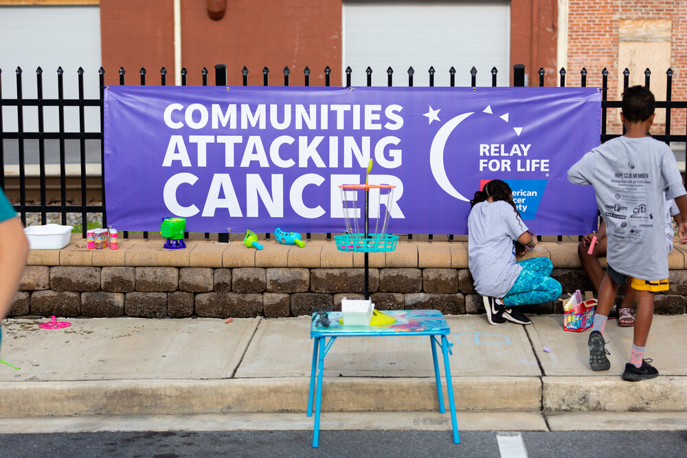 Relay For Life banner that says "Communities attacking cancer" with the Relay For Life/ACS logo