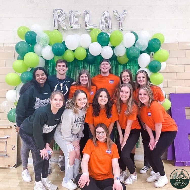 Students in front of balloons at Relay For Life event at Michigan State University