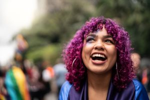 Smiling transgender woman at pride event